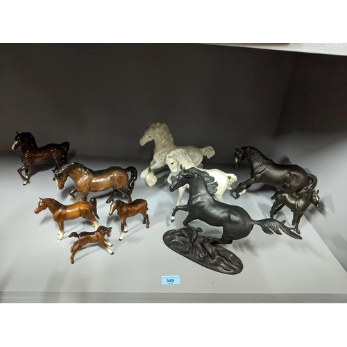 349 - A collection of Beswick and Royal Doulton horses and foals, along with a Franklin Mint model of Blac... 