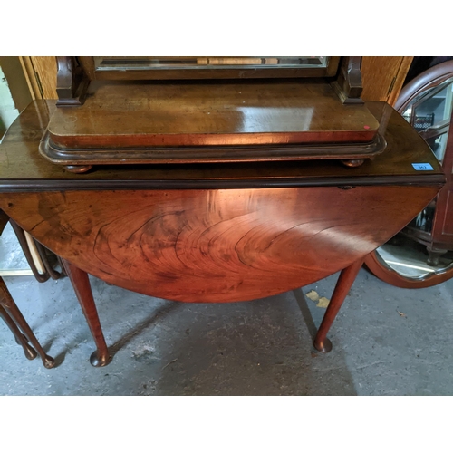 362 - A 19th century walnut drop leaf table, oval top with moulded edge on tapering legs and pad feet 72cm... 