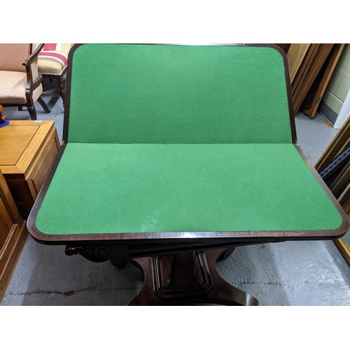 361 - A Regency rosewood pedestal fold over card table with inset green baize, shaped corners on square ta... 