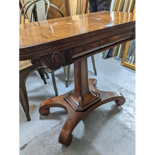 361 - A Regency rosewood pedestal fold over card table with inset green baize, shaped corners on square ta... 