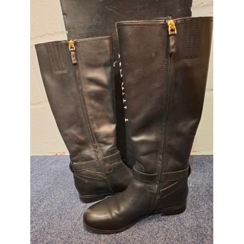 17 - Ralph Lauren- A pair of 'Brittainey' black leather boots, UK 5, having a side zip, gold tone hardwar... 