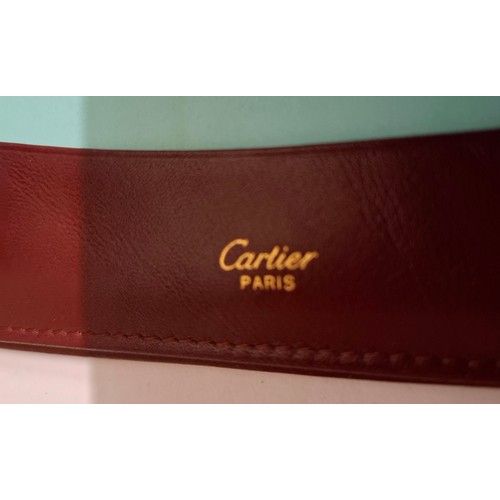 23 - Cartier - A burgundy leather stationary folio with Playboy pressed insignia to the front and Playboy... 