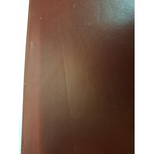 23 - Cartier - A burgundy leather stationary folio with Playboy pressed insignia to the front and Playboy... 