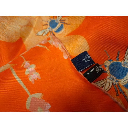 24 - Coutts- A commissioned Henry Poole & Co orange silk scarf with an attached label with the recipient'... 