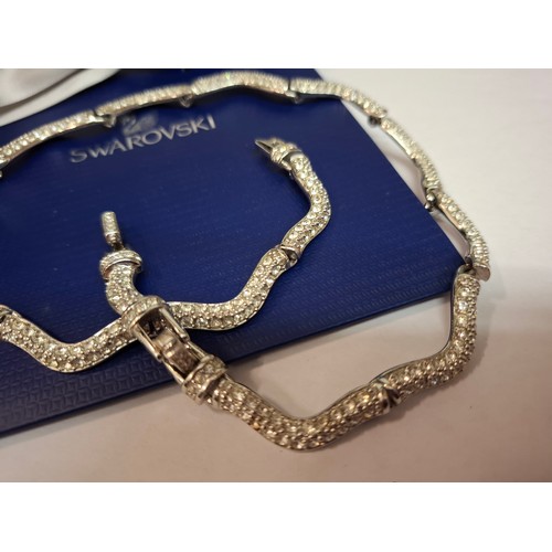 44 - Swarovski-A silver tone and white crystal necklace with branded bag. Location:
If there is no condit... 