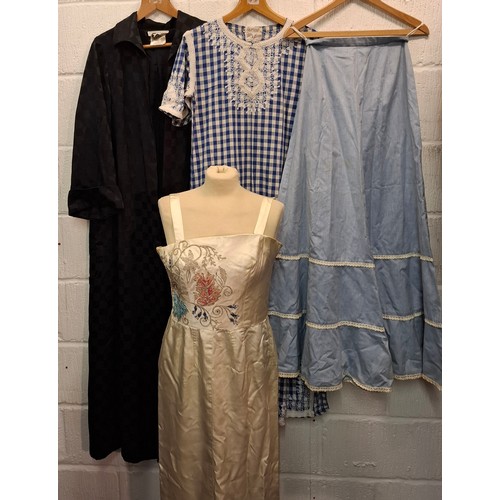 91 - A group of 1970's and later ladies clothing to include an Eastex full length black coat with chequer... 