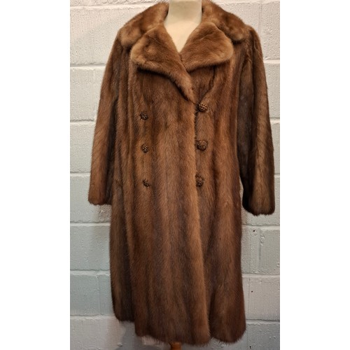 88 - A vintage light brown mink coat having 6 brown buttons to the front, approx 38