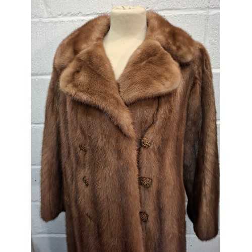 88 - A vintage light brown mink coat having 6 brown buttons to the front, approx 38