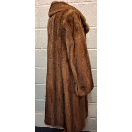 88 - A vintage light brown mink coat having 6 brown buttons to the front, approx 38