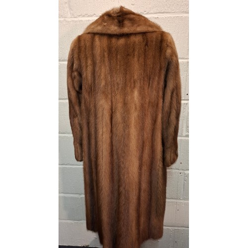 88 - A vintage light brown mink coat having 6 brown buttons to the front, approx 38