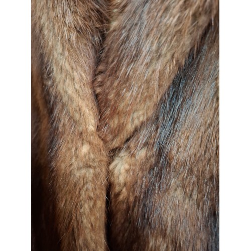 87 - Two vintage fur coats comprising a brown mink coat having a shawl collar, approx 38