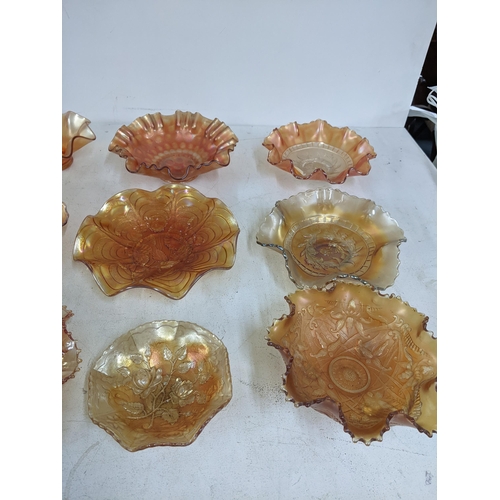 131 - A collection of Marigold carnival glass to include dishes, plates and stemmed bowls Location: 3.3
If... 