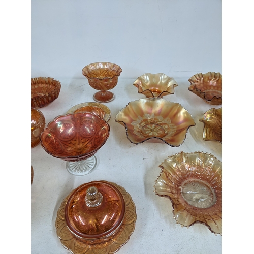 131 - A collection of Marigold carnival glass to include dishes, plates and stemmed bowls Location: 3.3
If... 