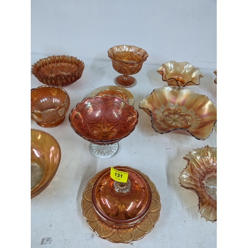 131 - A collection of Marigold carnival glass to include dishes, plates and stemmed bowls Location: 3.3
If... 