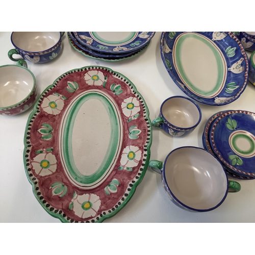 139 - An Italian hand painted dinner service to include plates, a platter, a serving dish and other items
... 