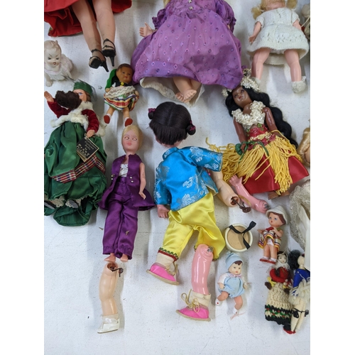 14 - Mixed dolls to include nodding dolls, some in formal dress and dolls fashioned as young children A/F... 