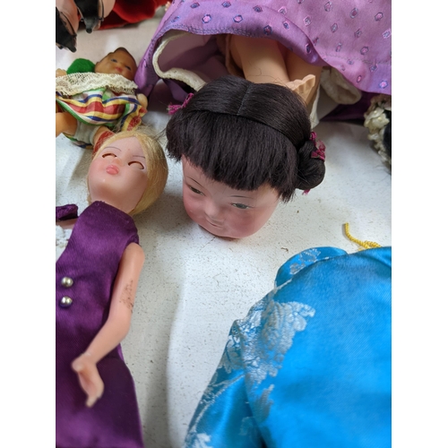 14 - Mixed dolls to include nodding dolls, some in formal dress and dolls fashioned as young children A/F... 