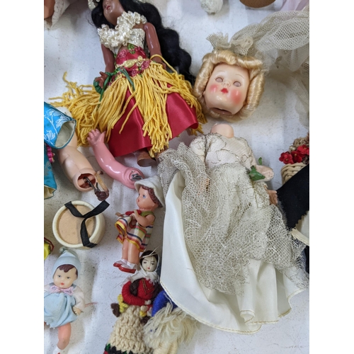 14 - Mixed dolls to include nodding dolls, some in formal dress and dolls fashioned as young children A/F... 