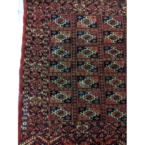 144 - Two rugs to include a Tekki Bokhara rug measuring 107cm x 69cm, together with later reproduction Bok... 