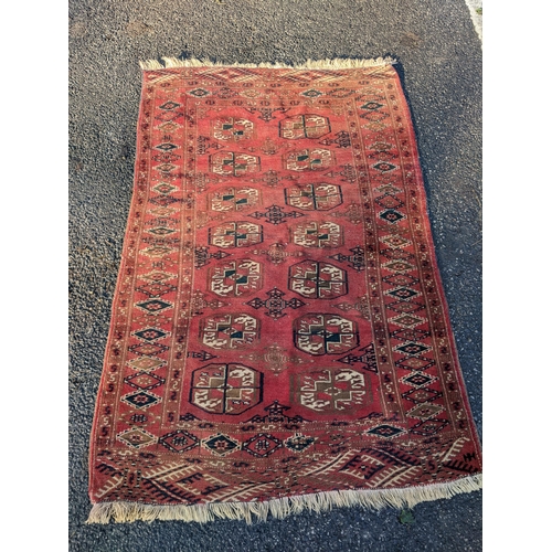 144 - Two rugs to include a Tekki Bokhara rug measuring 107cm x 69cm, together with later reproduction Bok... 