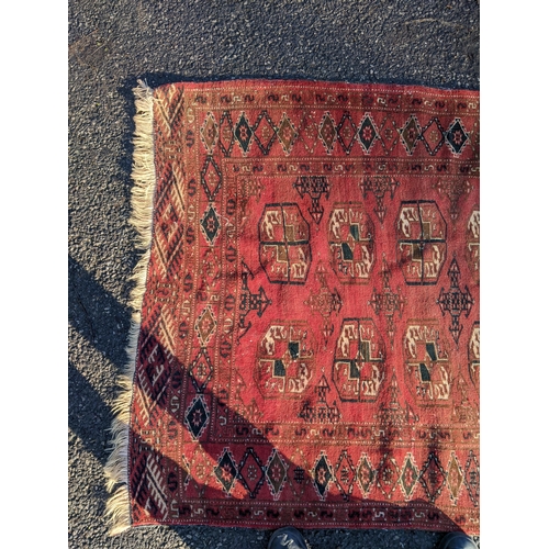 144 - Two rugs to include a Tekki Bokhara rug measuring 107cm x 69cm, together with later reproduction Bok... 