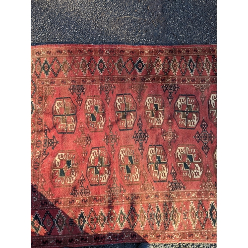 144 - Two rugs to include a Tekki Bokhara rug measuring 107cm x 69cm, together with later reproduction Bok... 