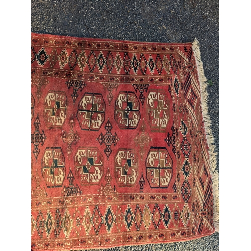 144 - Two rugs to include a Tekki Bokhara rug measuring 107cm x 69cm, together with later reproduction Bok... 