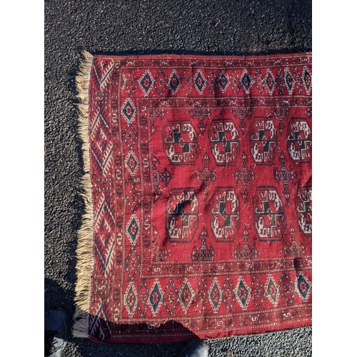 144 - Two rugs to include a Tekki Bokhara rug measuring 107cm x 69cm, together with later reproduction Bok... 