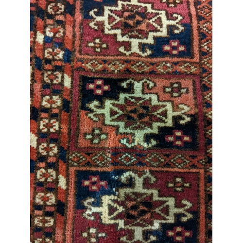 144 - Two rugs to include a Tekki Bokhara rug measuring 107cm x 69cm, together with later reproduction Bok... 