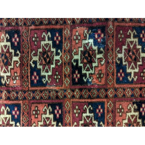 144 - Two rugs to include a Tekki Bokhara rug measuring 107cm x 69cm, together with later reproduction Bok... 