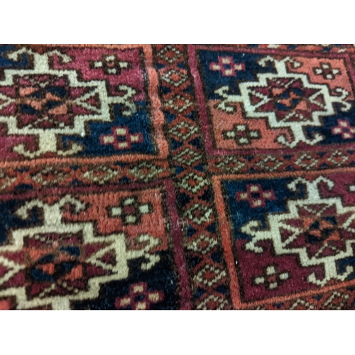 144 - Two rugs to include a Tekki Bokhara rug measuring 107cm x 69cm, together with later reproduction Bok... 