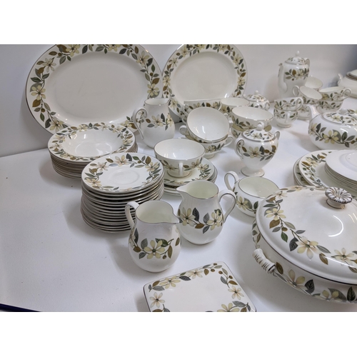 153 - A Wedgwood Beaconsfield pattern dinner and tea services to include a tureen, plates, soup bowls, tea... 