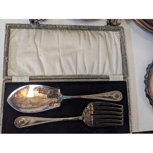 155 - A collection of silver plated items to include a breakfast dish with a hinged lid and four legs, a t... 