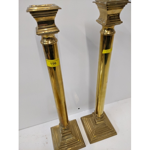 156 - Two 20th century brass candlesticks on mounted plinths, 55.5cm h
Location: RAB
If there is no condit... 