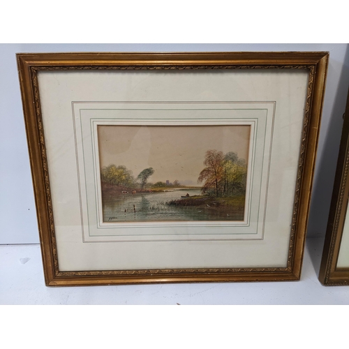 162 - A framed 19th century watercolour depicting a river scene with a church tower in the horizon, signed... 