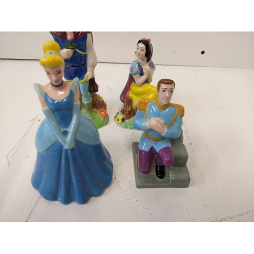 167 - Four Paul Carden Disney figures to include: Snow White and Prince salt and pepper shakers, Cinderell... 