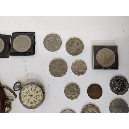 168 - A group of collectables to include two compasses, a pocket watch with a roman dial, commemorative co... 