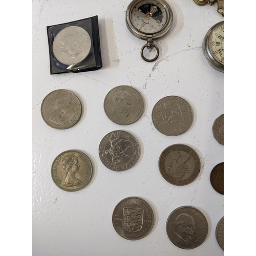 168 - A group of collectables to include two compasses, a pocket watch with a roman dial, commemorative co... 