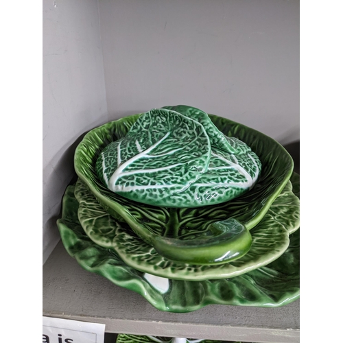 17 - A Portuguese Bordallo Pinheiro cabbage leaf patterned Majolica dinner service to include dinner plat... 