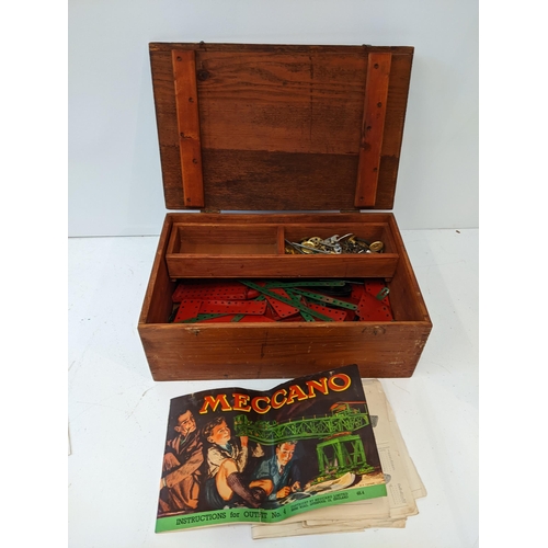 171 - A wooden box containing Meccano pieces, instructions for outfit no4
Location: GM
If there is no cond... 