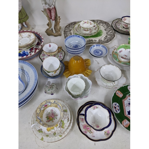 18 - A mixed lot of china and ceramics to include meat plates, Chinese style bowls, collectors spoons and... 