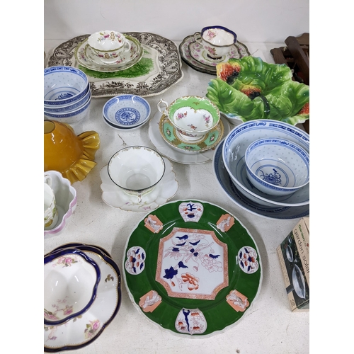 18 - A mixed lot of china and ceramics to include meat plates, Chinese style bowls, collectors spoons and... 