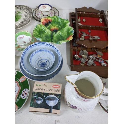 18 - A mixed lot of china and ceramics to include meat plates, Chinese style bowls, collectors spoons and... 