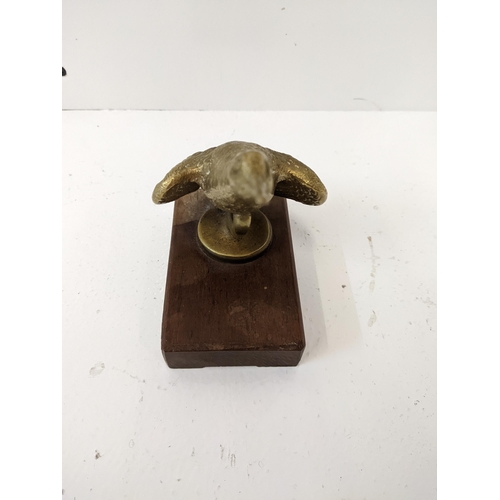 183 - A bronze car mascot of a snipe, mounted on a wooden plinth.
Location: 1-4
If there is no condition r... 