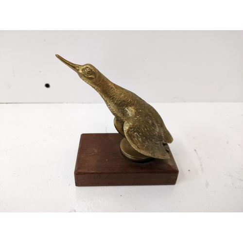 183 - A bronze car mascot of a snipe, mounted on a wooden plinth.
Location: 1-4
If there is no condition r... 