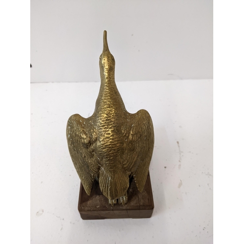 183 - A bronze car mascot of a snipe, mounted on a wooden plinth.
Location: 1-4
If there is no condition r... 