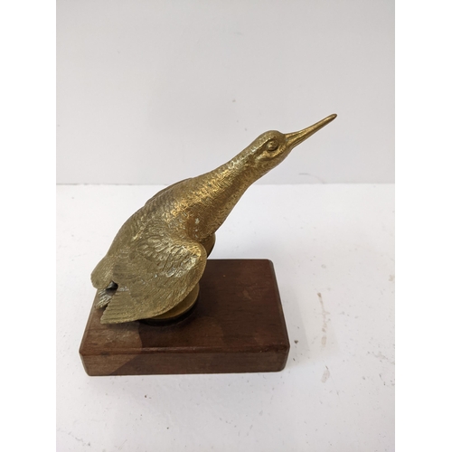 183 - A bronze car mascot of a snipe, mounted on a wooden plinth.
Location: 1-4
If there is no condition r... 