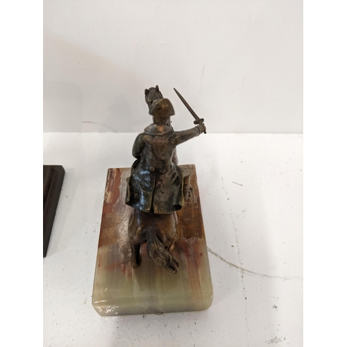 188 - A casting figure of Napoleon on horseback along with a pressed metal casting of Napoleon on a steppe... 