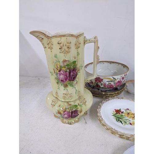 20 - A mixed china to include Spode Christmas plates, Bartlam teapots and other vases with floral decorat... 