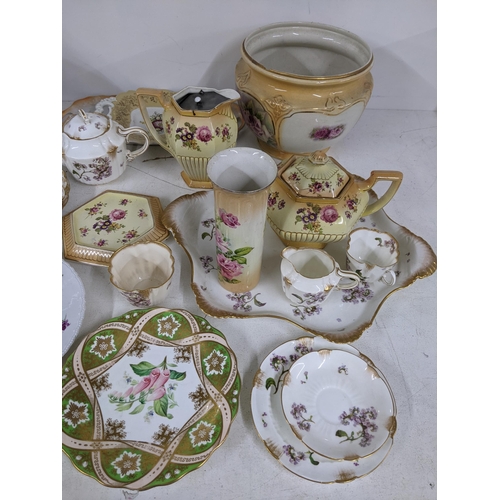 20 - A mixed china to include Spode Christmas plates, Bartlam teapots and other vases with floral decorat... 